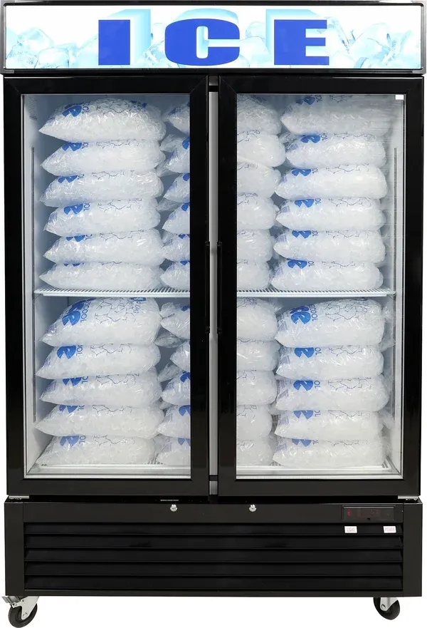 Commercial ice display freezer loaded with bagged ice, backlit ICE signage above twin glass doors
